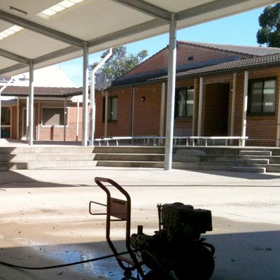 Pressure cleaning equipment at work on a commercial property.