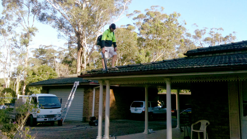 A gutter being cleaned out.
